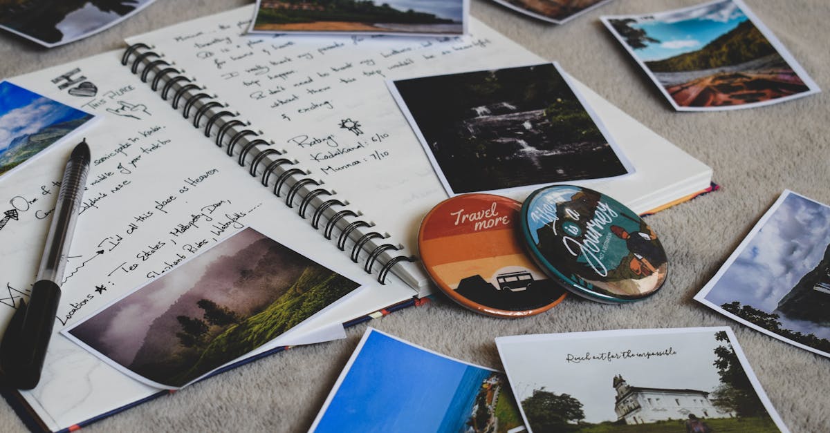 Travel diary surrounded by printed photos and a pen, capturing memories creatively.